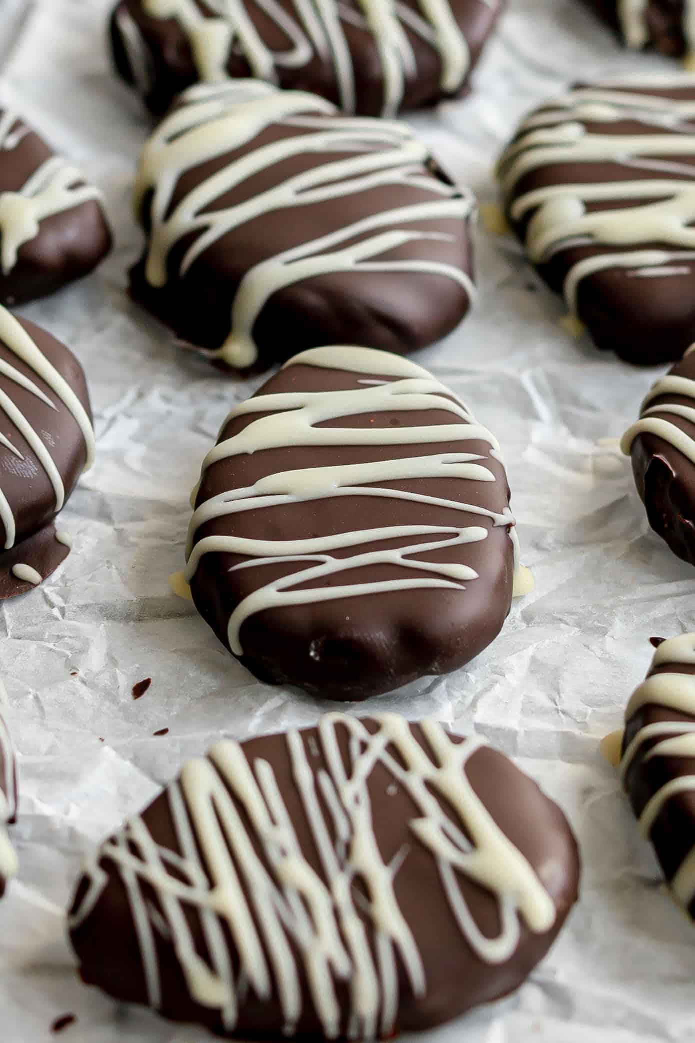 Cookie dough easter eggs on a sheet of parchment paper.