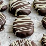 Cookie dough easter eggs on a sheet of parchment paper.
