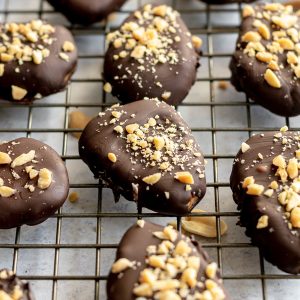 Peanut butter easter eggs on a cooling rack.