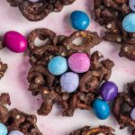 Birds nest cookies arranged with a few chocolate covered peanuts.