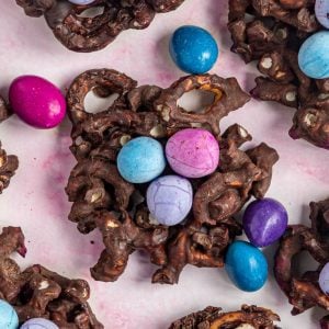 Birds nest cookies arranged with a few chocolate covered peanuts.