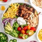 A vegan taco bowl loaded with toppings.