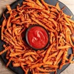 Oil-Free Jicama fries on a serving tray with ketchcup.