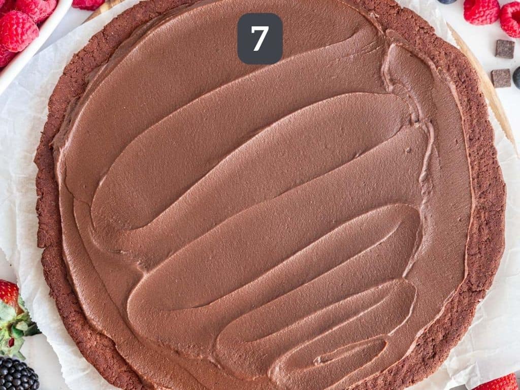 Vegan Chocolate Fruit Pizza Step 7 - frost the cookie.