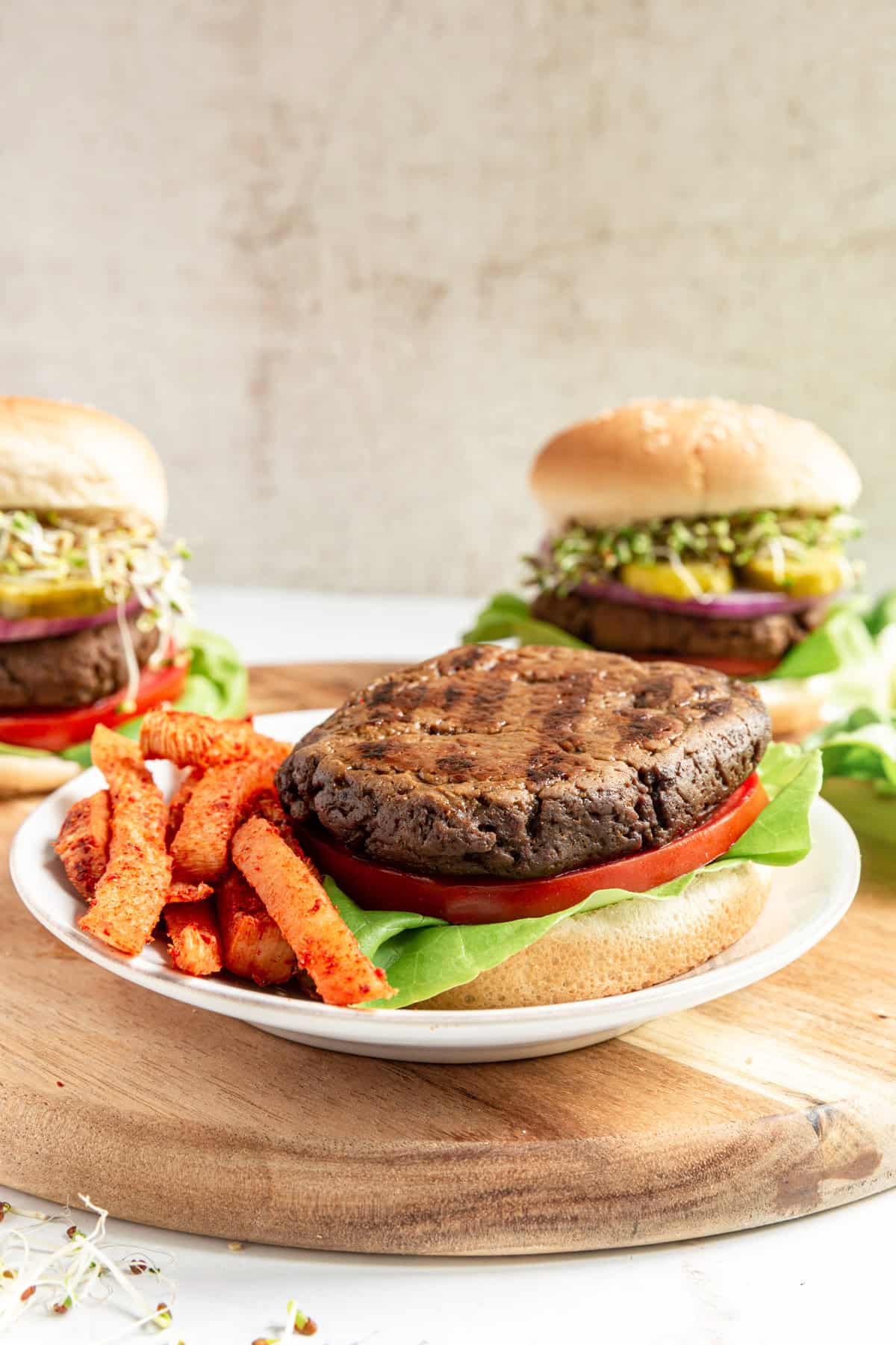 An open faced seitan burger served with jicama fries.
