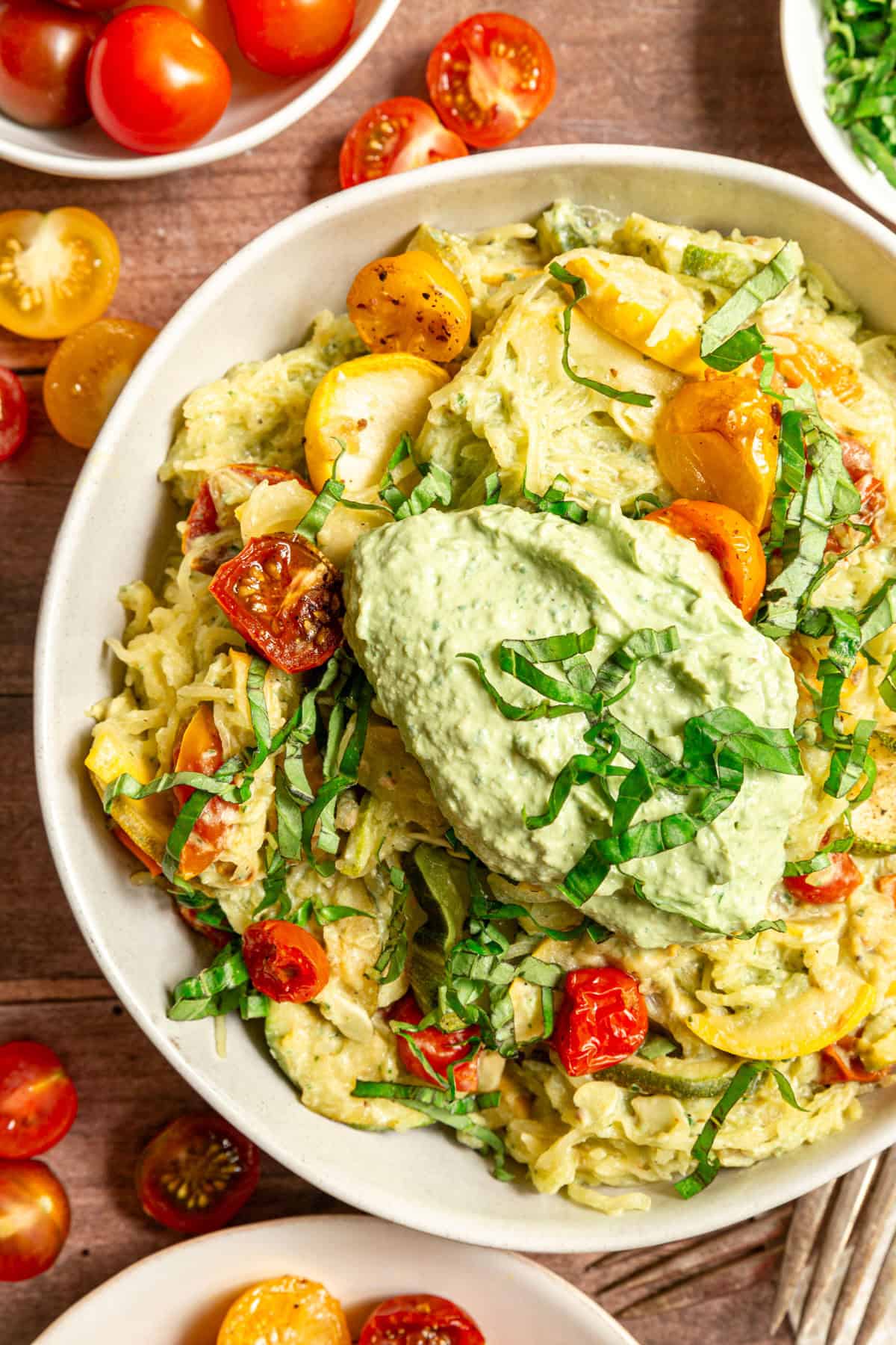 A bowl of Vegan Pesto Spaghetti Squash, topped with extra pesto.