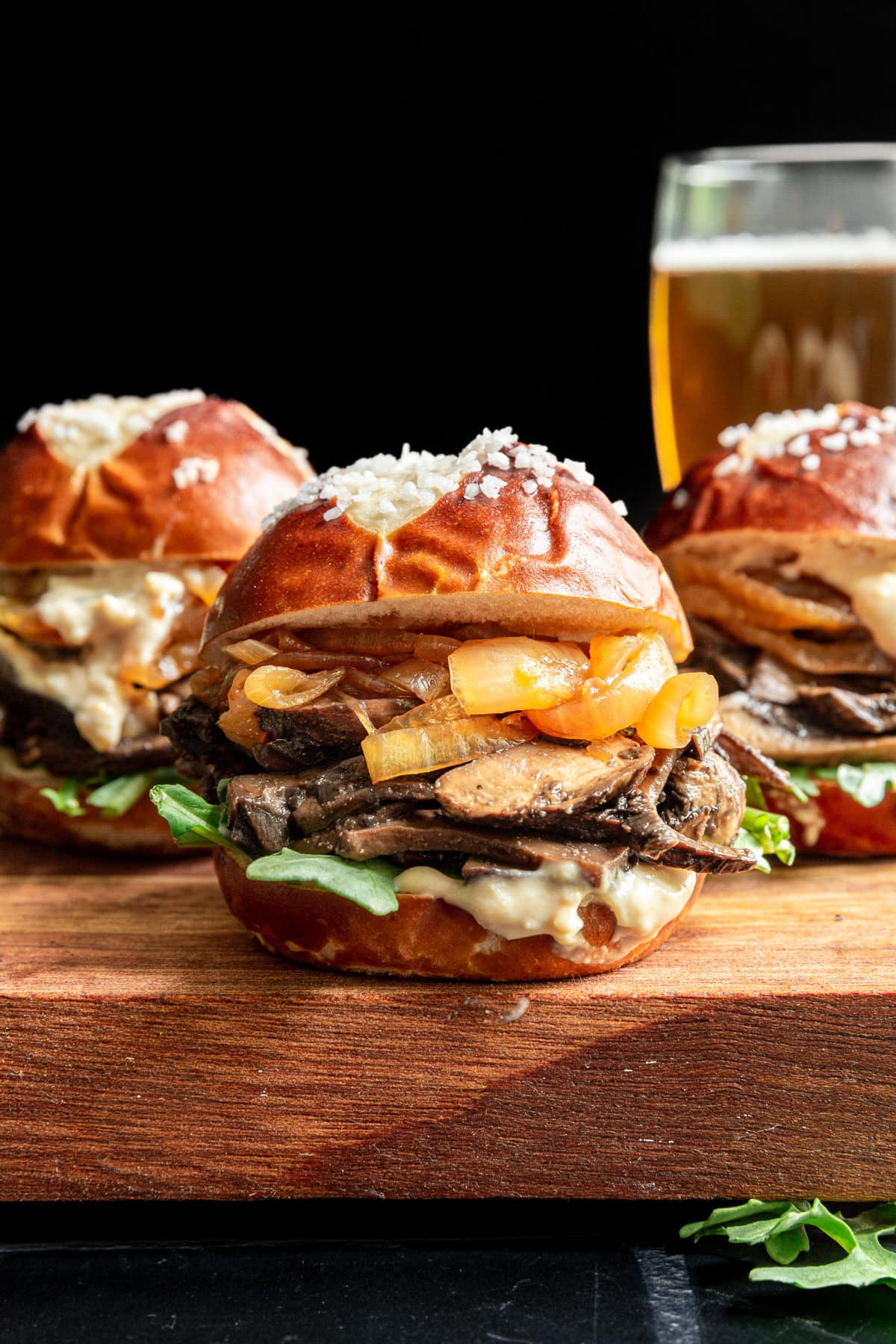 Three Portobello Mushroom Sliders served with a beer.