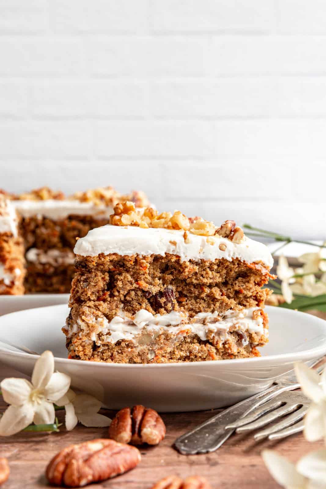 A slice of Vegan Oil-Free Carrot Cake ready to eat.