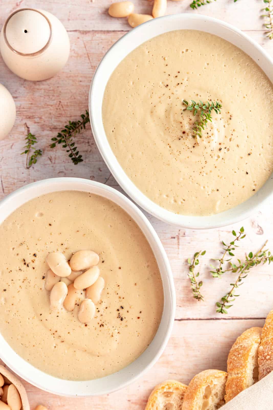 Two bowls of Creamy Cauliflower White Bean Soup.