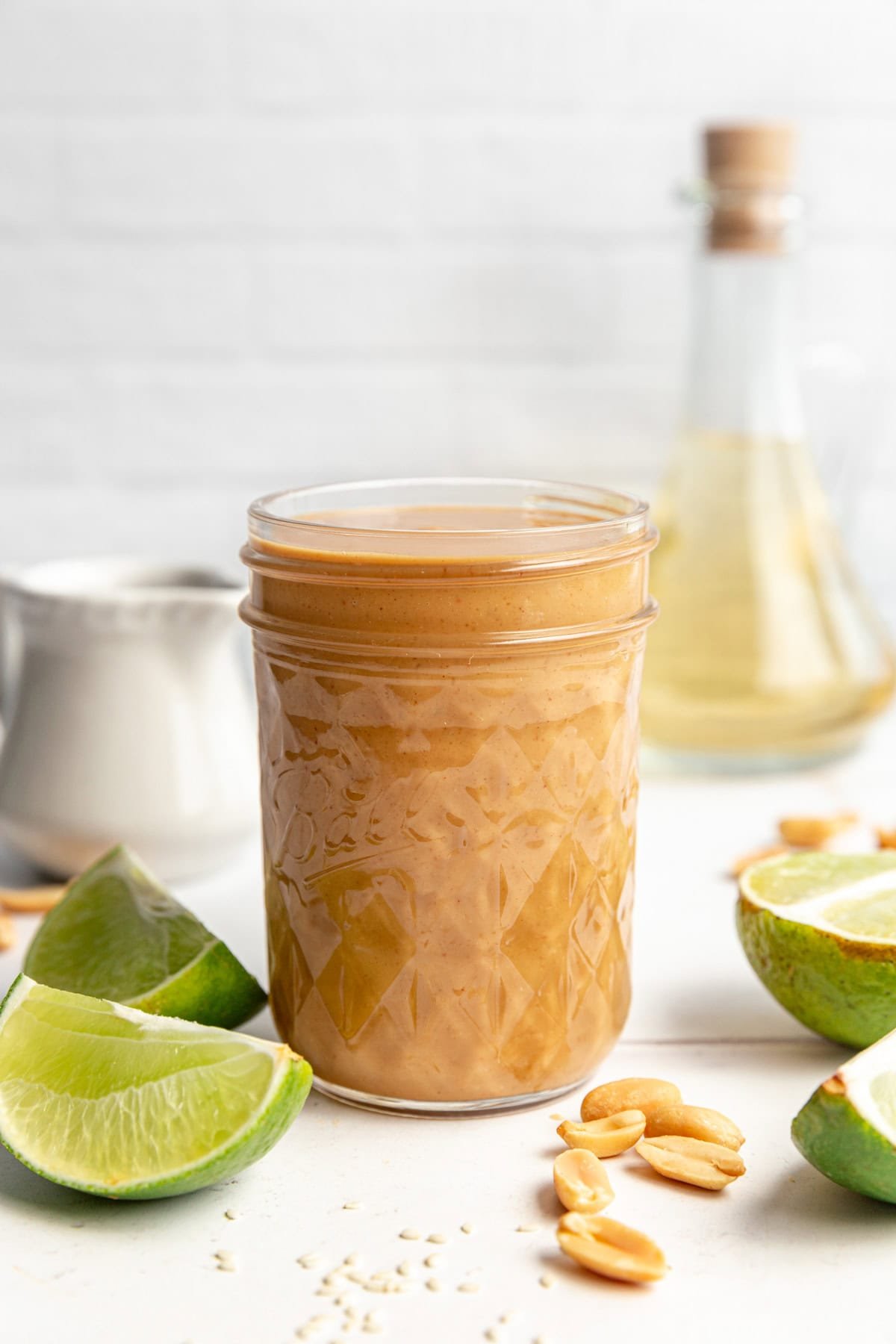 A jar of Healthy Peanut Sesame Dressing.