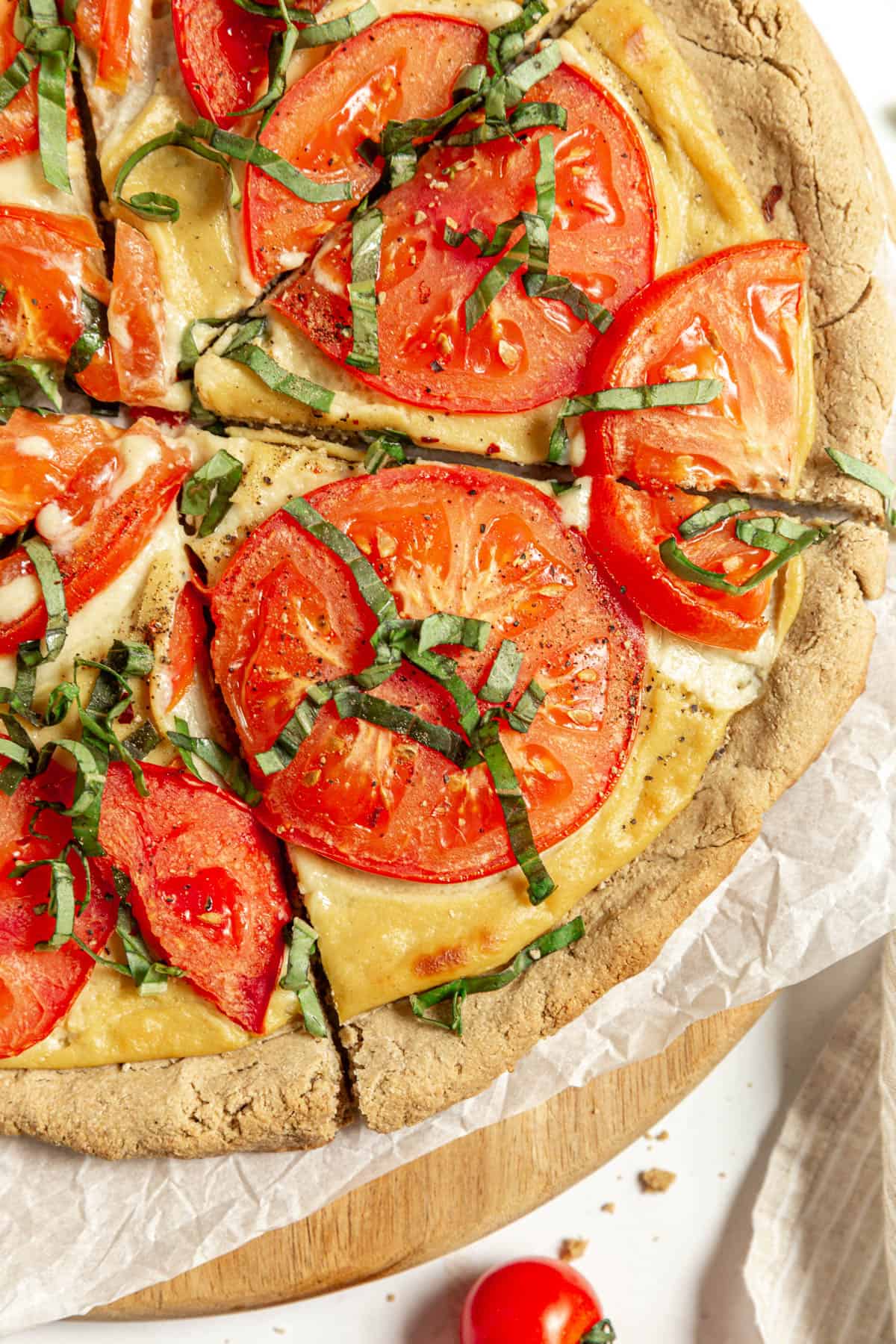 Vegan margherita pizza on vegan oat flour pizza crust.