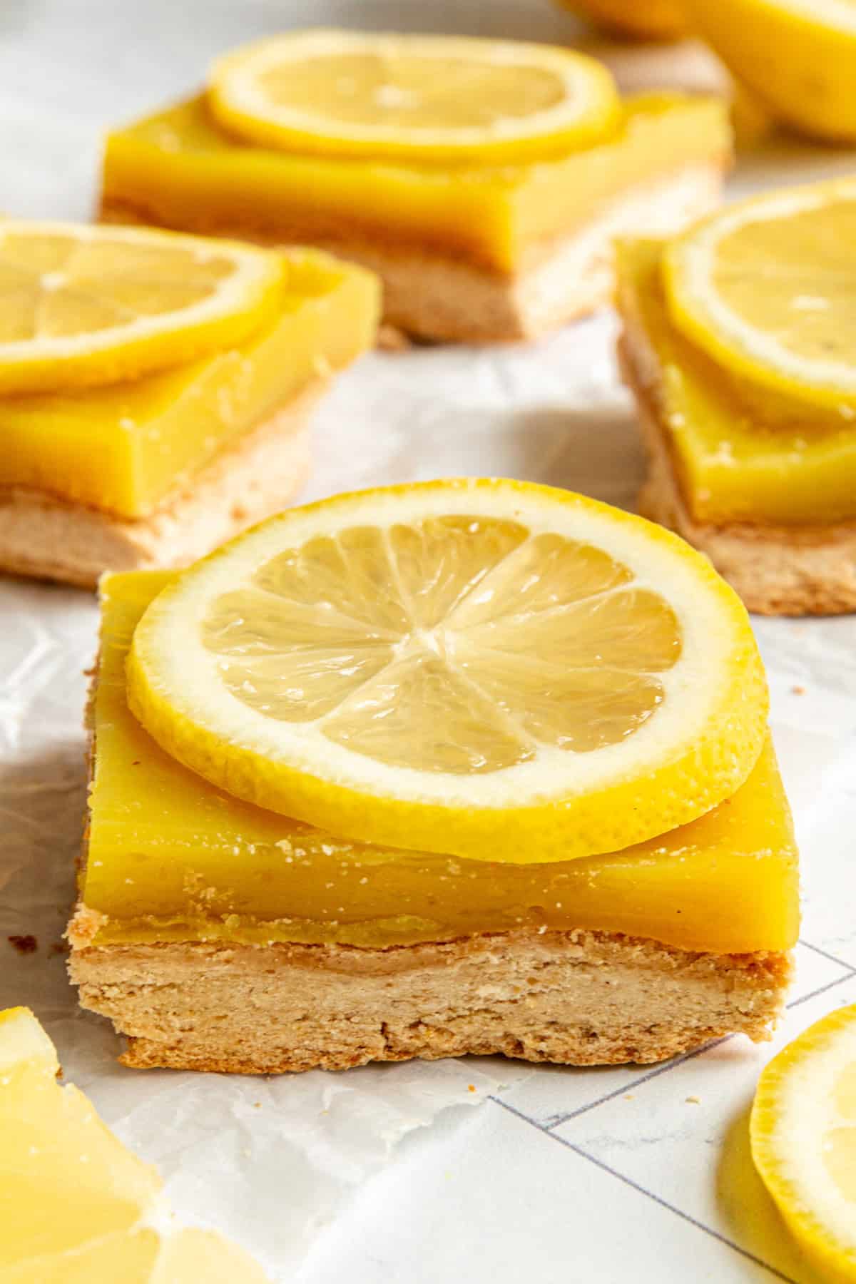 A Plant-Based Lemon Bar with a slice of lemon on top.