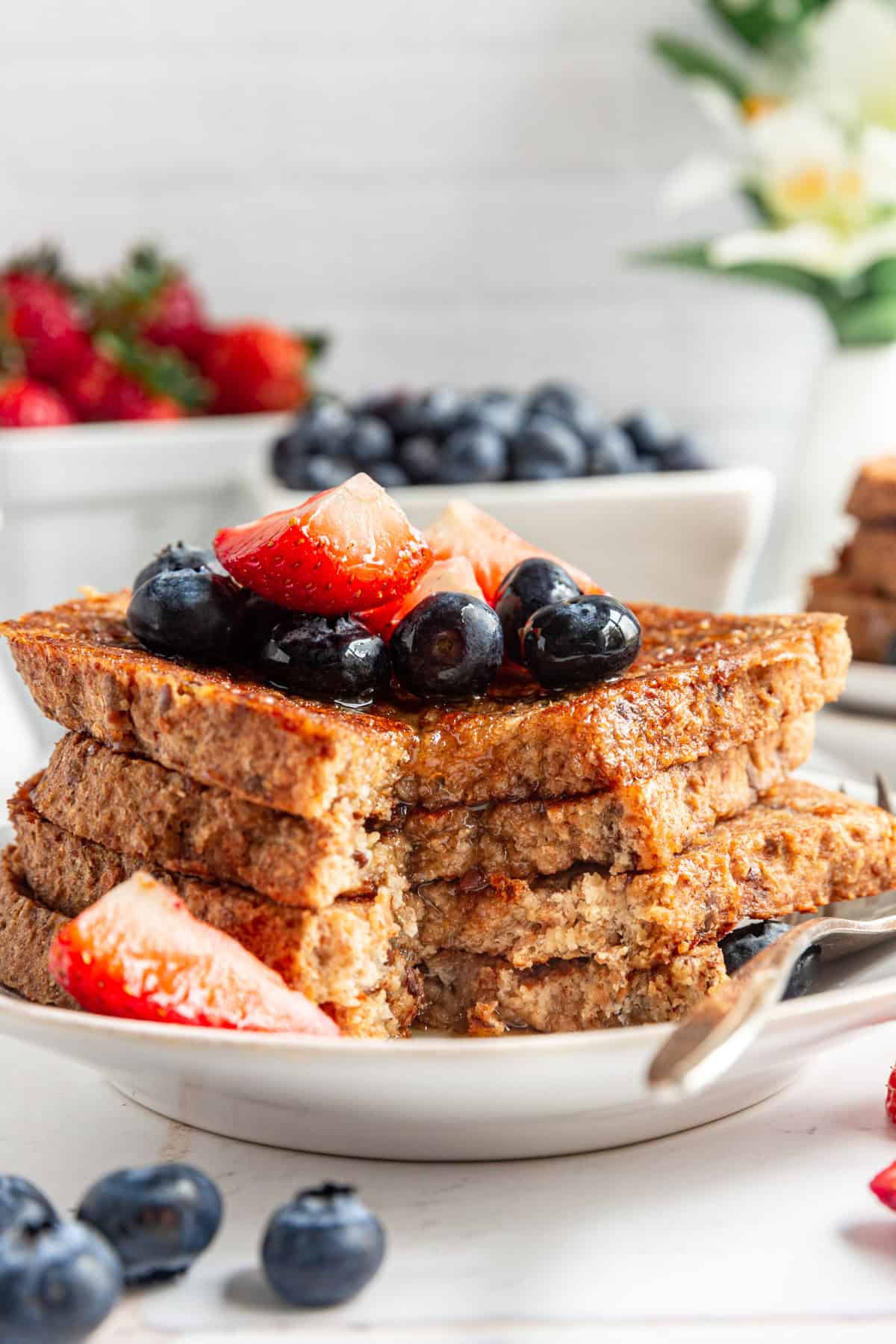 A slice taken out of a stack of Vegan High Protein French Toast.