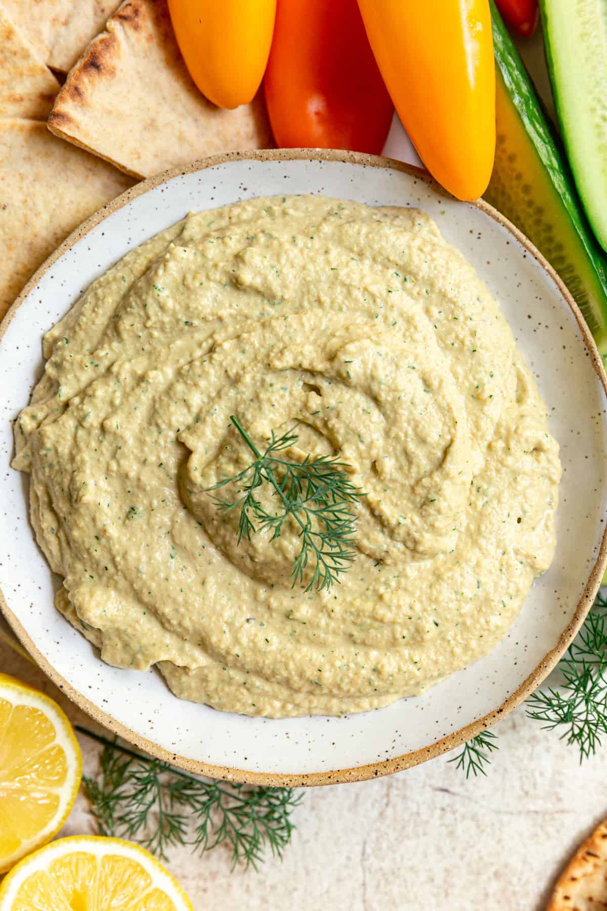 A bowl of Lemon Dill Hummus ready to serve.