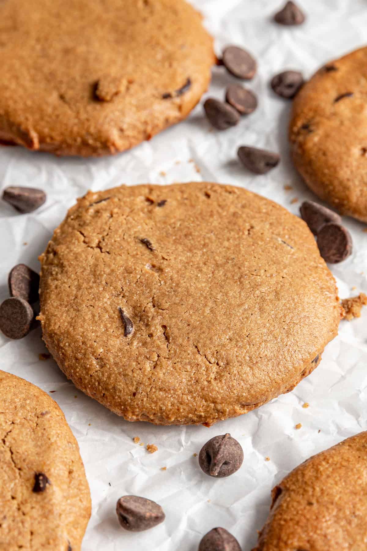 Several cookies on a sheet of parchment paper.