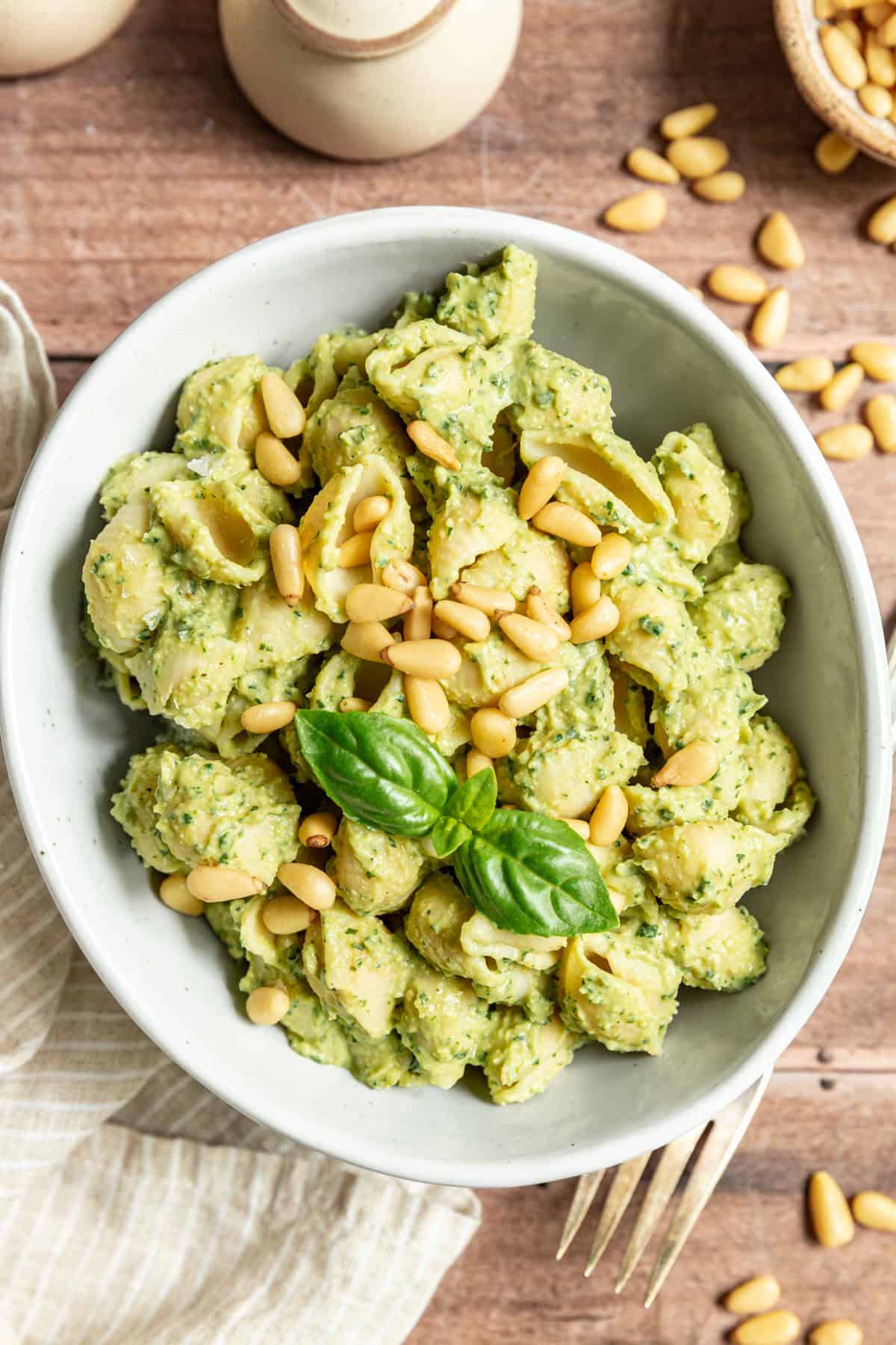 A bowl of pasta covered in Vegan White Bean Pesto Dip.