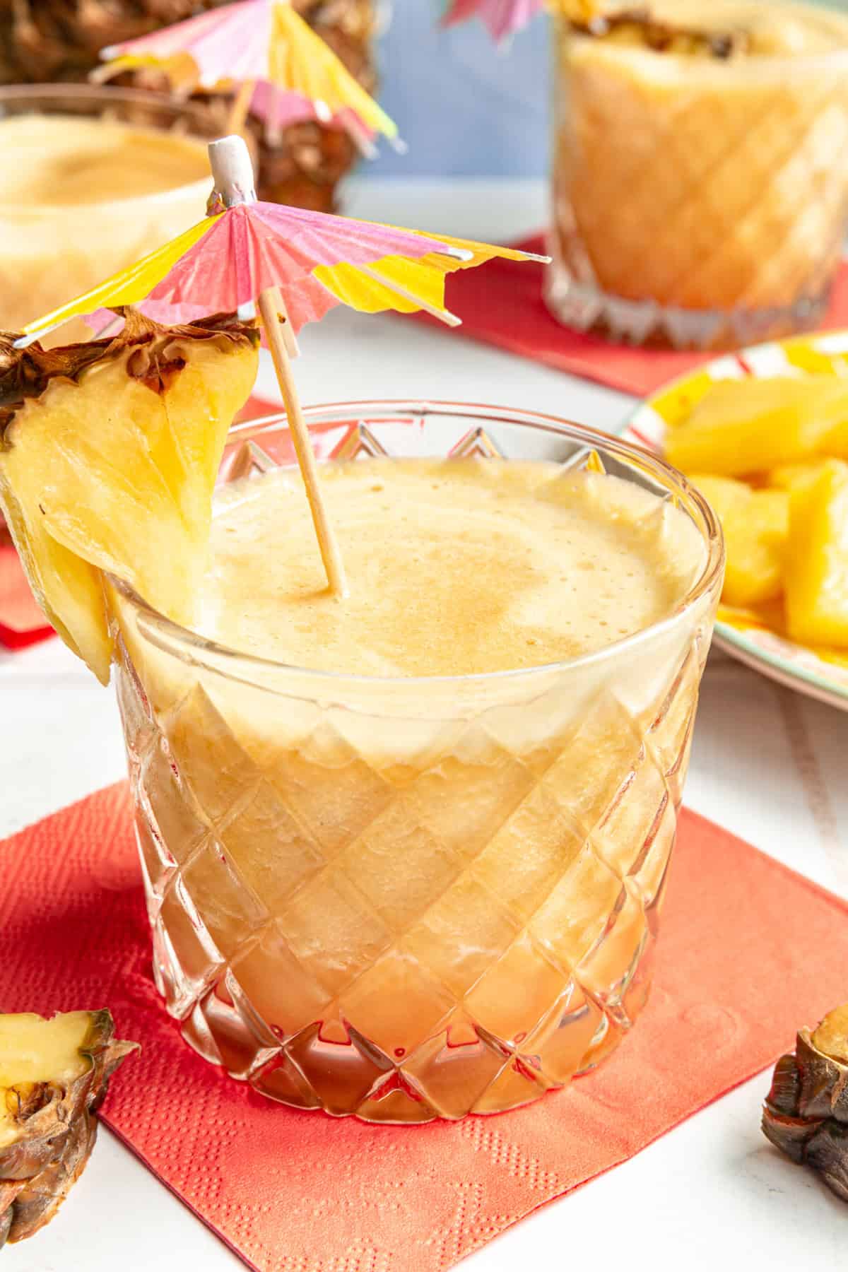 A freshly made Piña Colada Mocktail served on a pink napkin.