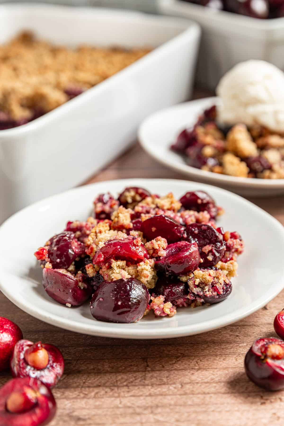 Two plates of Vegan Cherry Crumble.