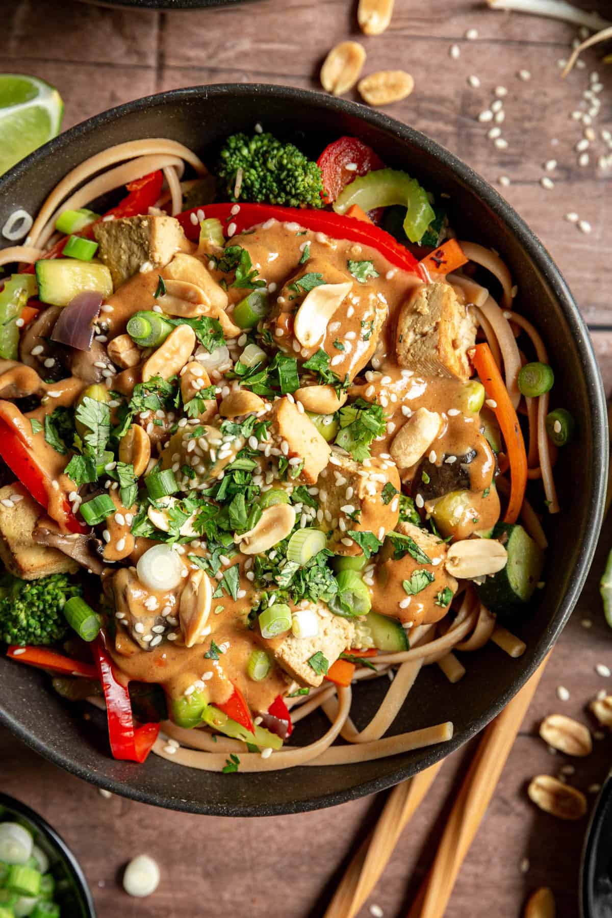 A bowl of Vegan Oil-Free Pad Thai garnished with peanuts.