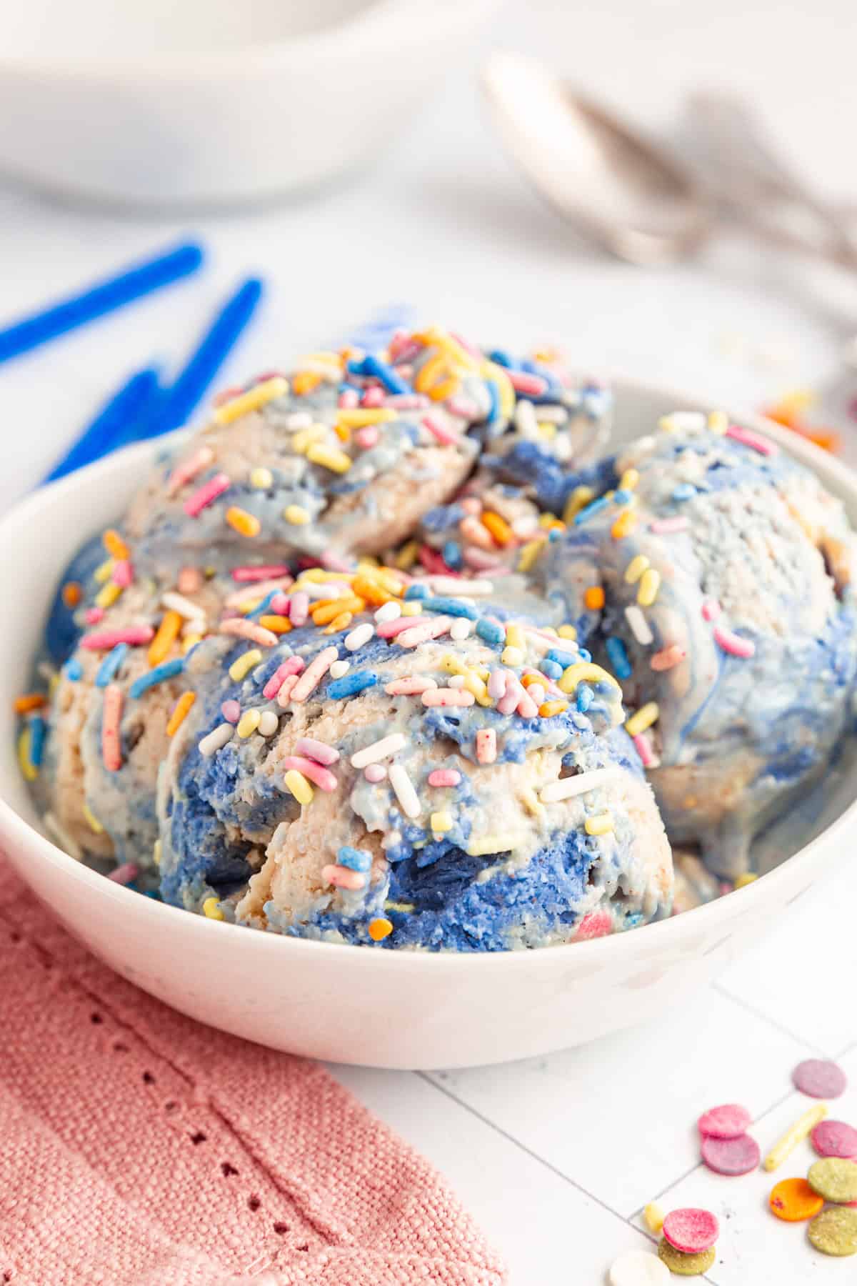 A bowl of Vegan Birthday Cake Batter Ice Cream covered in sprinkles.