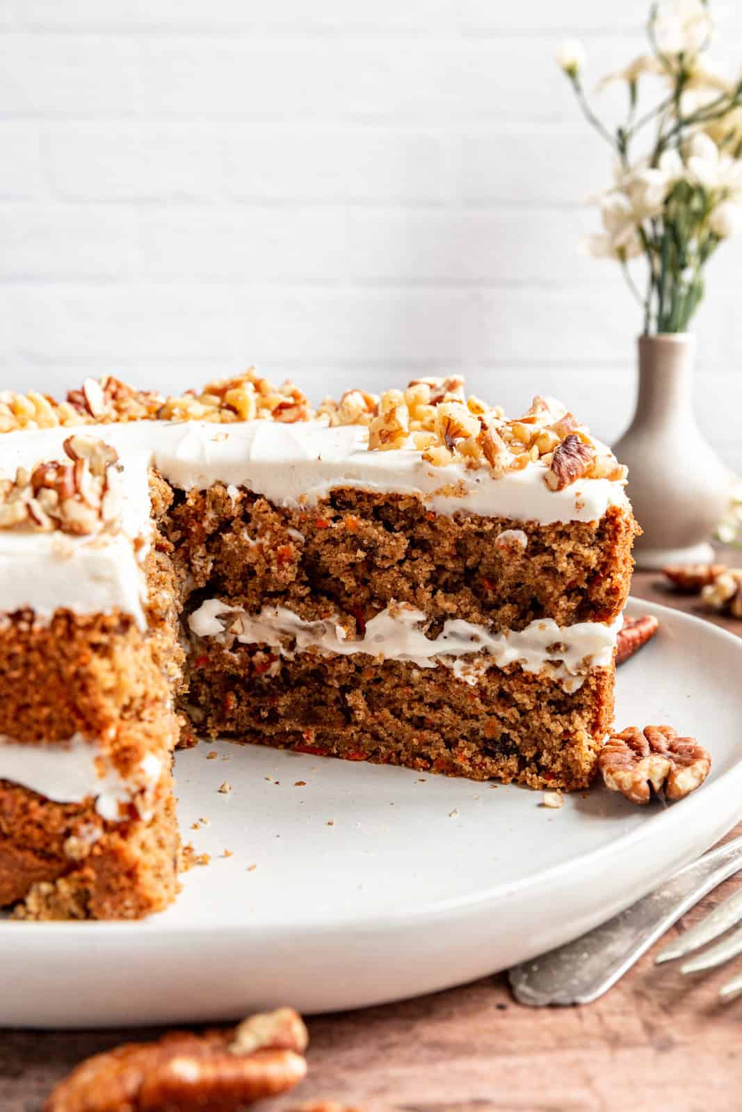 Vegan Oil-Free Carrot Cake with a slice taken out.