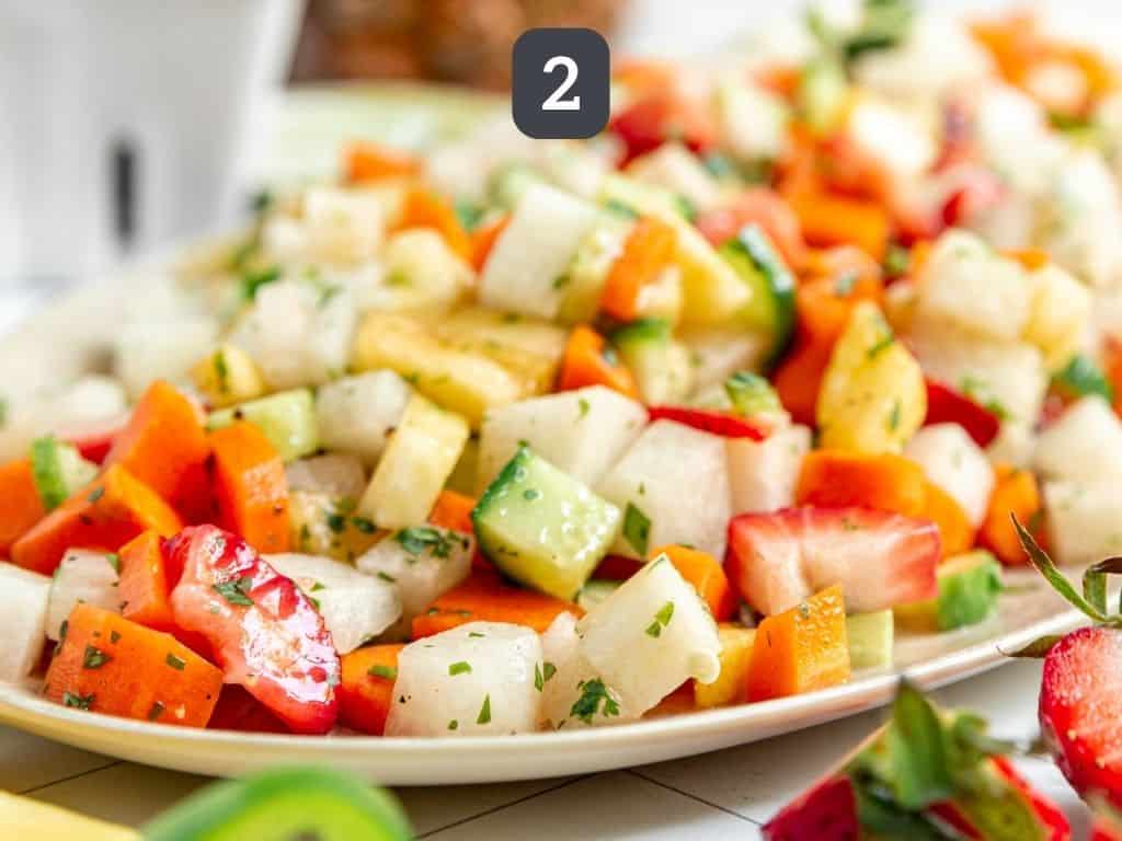 Jicama Pineapple Slaw Step 2 - transfer to a platter and serve.