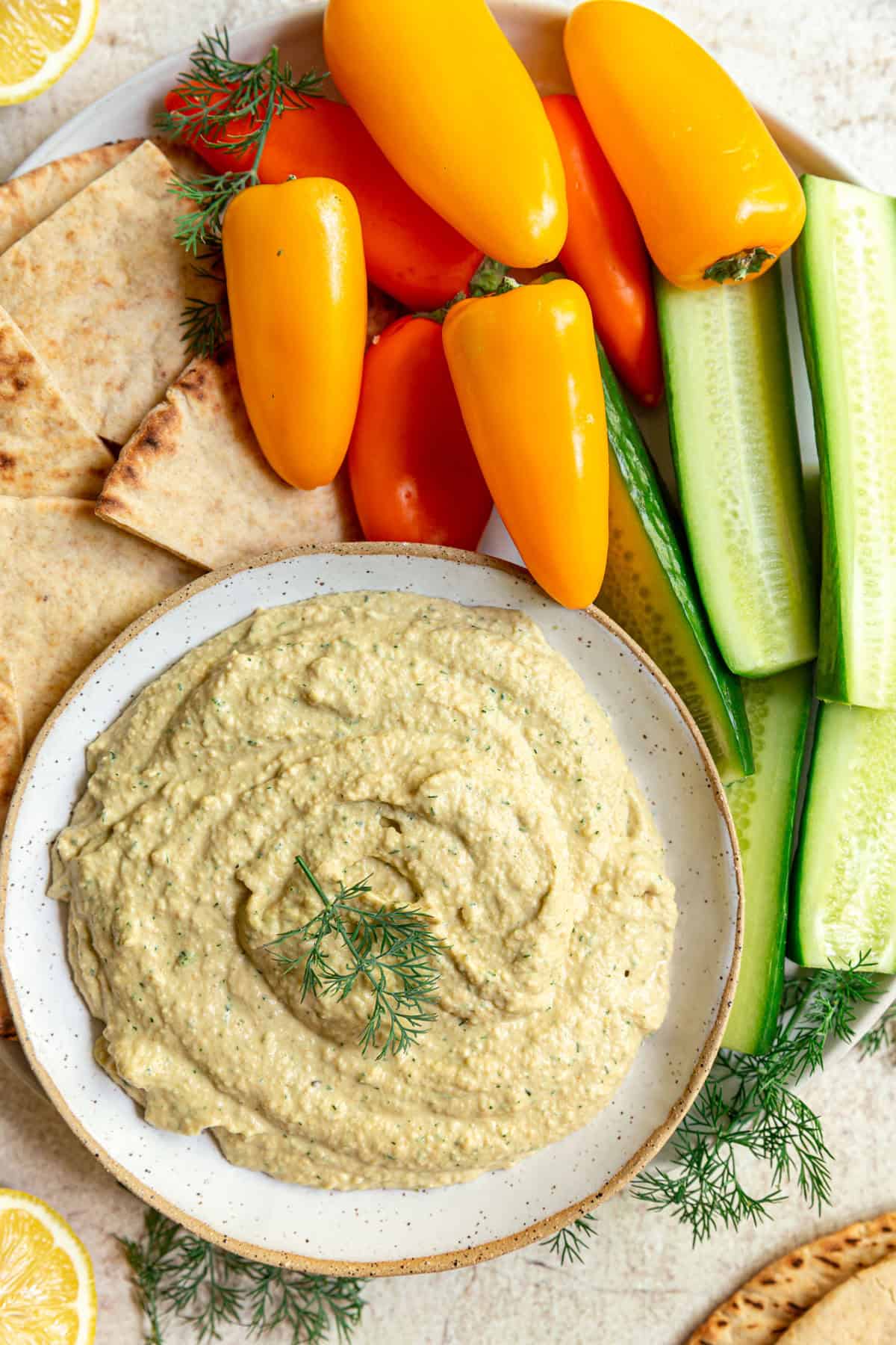 Fresh vegetables and pita with a bowl of lemon dill hummus.