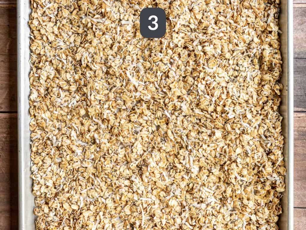 Easy Vanilla Coconut Granola Step 3 - spread the oats on the pan and bake.