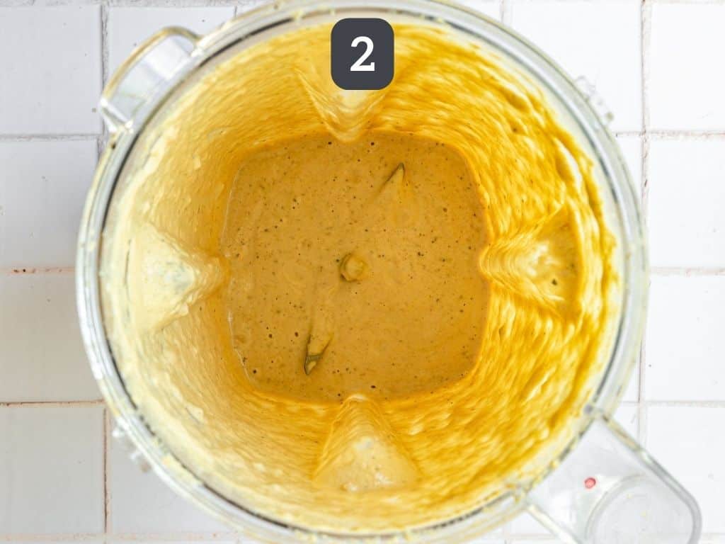 Vegan Oil-Free Cashew Caesar Salad Dressing Step 2 - blend, adding the water.
