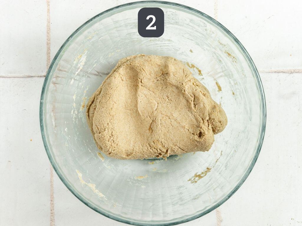 Oil-Free Vegan Oat Flour Pizza Crust Step 2 - add the wet ingredients and stir into a dough.