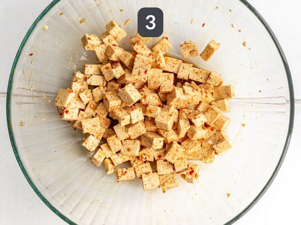 Thai Peanut Cabbage Salad Step 3 - toss tofu in sauce.