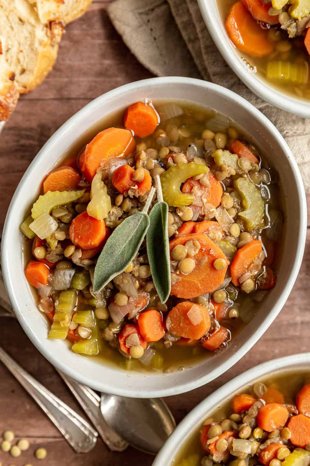 Carrot and Lentil Soup garnished with sage.