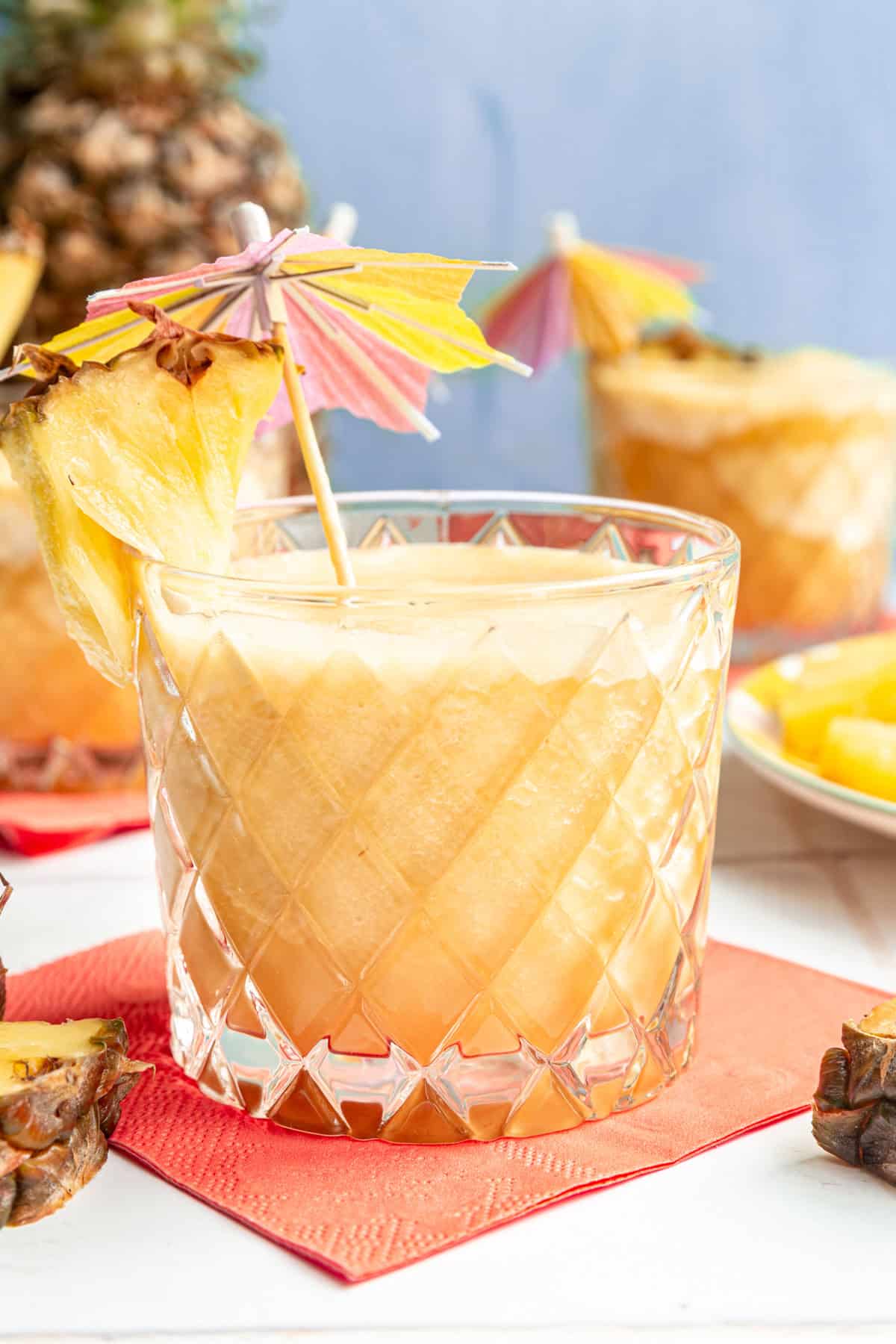 Piña Colada Mocktail garnished with an umbrella.
