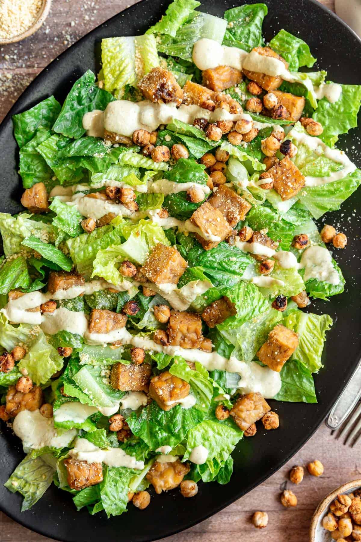 Tempeh caesar salad dressed with Vegan Oil-Free Cashew Caesar Salad Dressing.