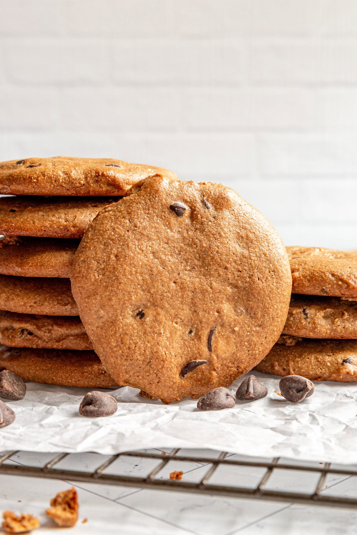 Two stacks of Vegan Oil-Free Chocolate Chip Cookies on a wire rack.