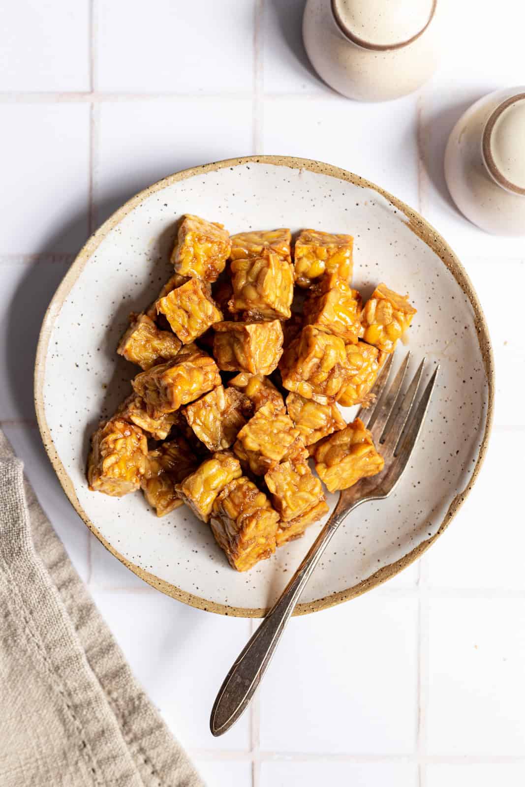 A bowl of air fried tempeh.