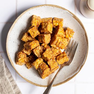 A bowl of air fried tempeh.