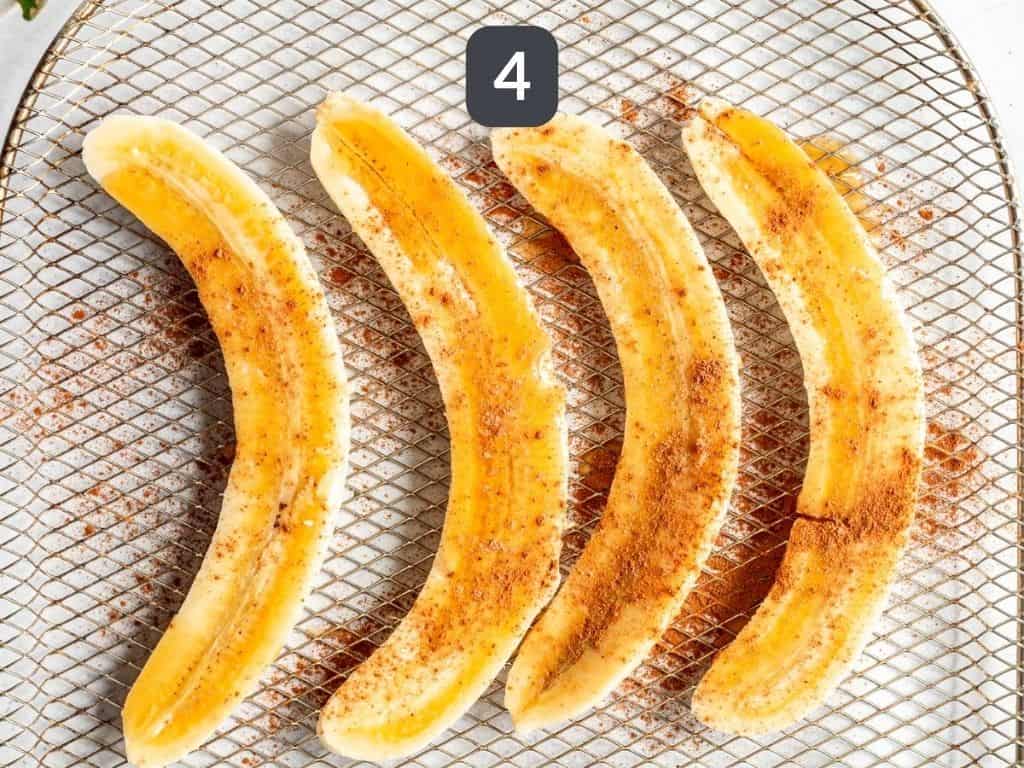 Air fryer bananas step 4 - drizzle with syrup and sprinkle with cinnamon.