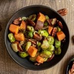 A bowl of roasted brussels sprouts and sweet potatoes.