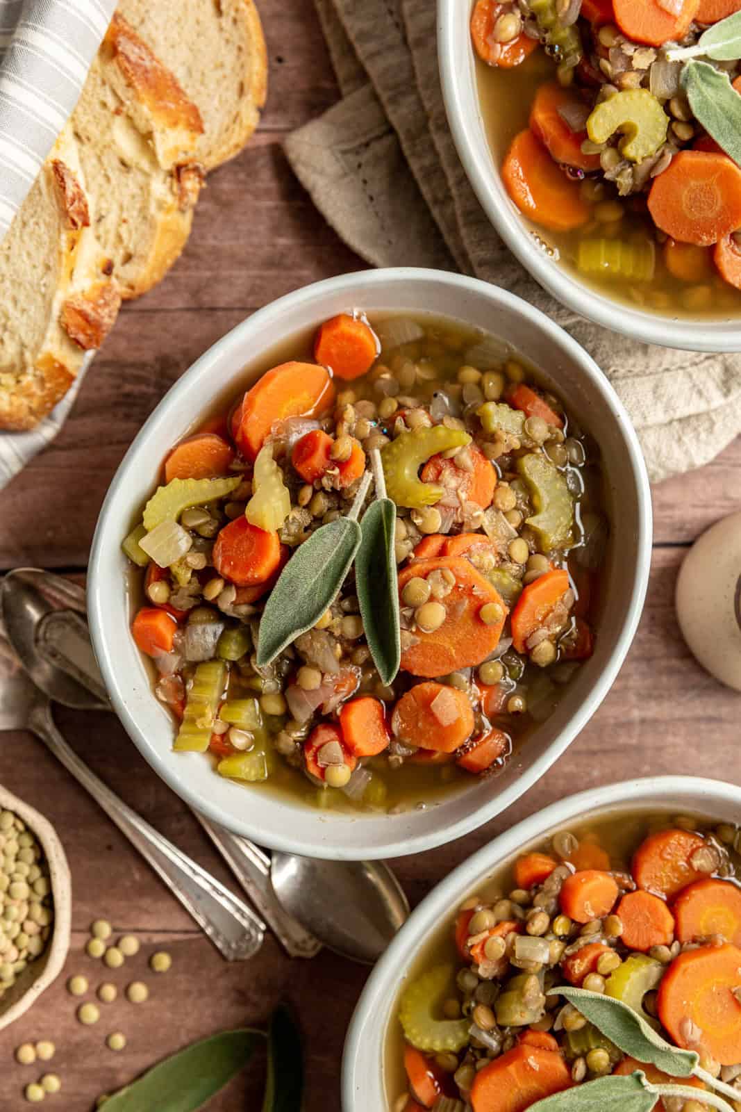 A bowl of carrot and lentil soup ready to eat.