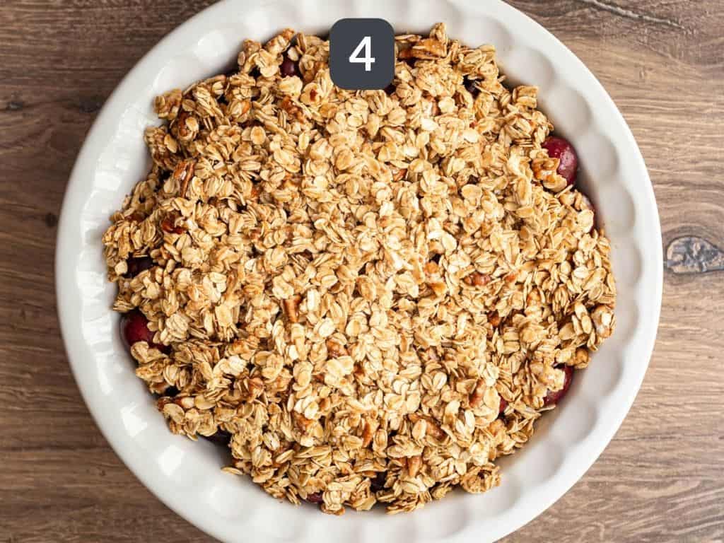 Vegan gluten free cherry crisp step 4 - top the cherries with the crisp.