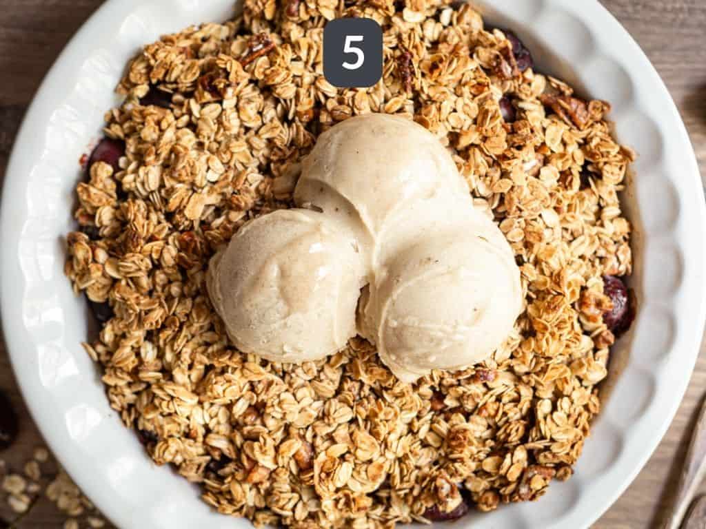 Vegan gluten free cherry crisp step 5 - bake then top with ice cream.