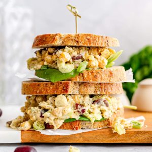 Two chickpea salad sandwiches stacked on top of each other.