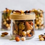 A glass jar filled with chickpea trail mix.