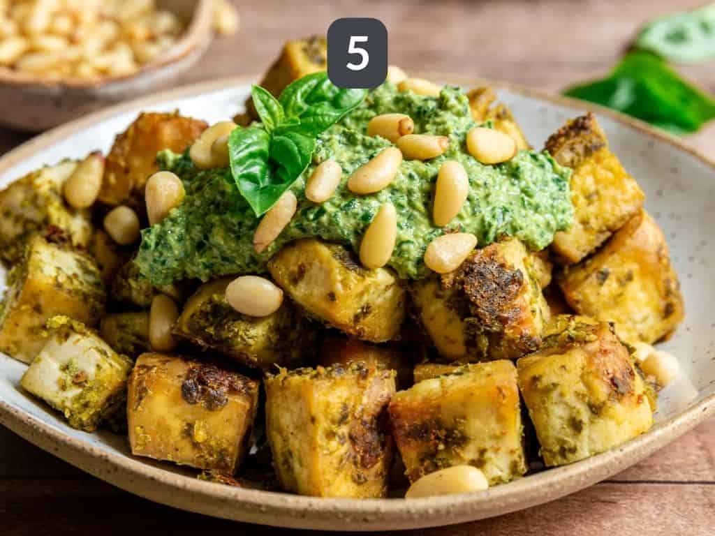 Easy Pesto Tofu Step 5 - toss the baked tofu with the remaining pesto.