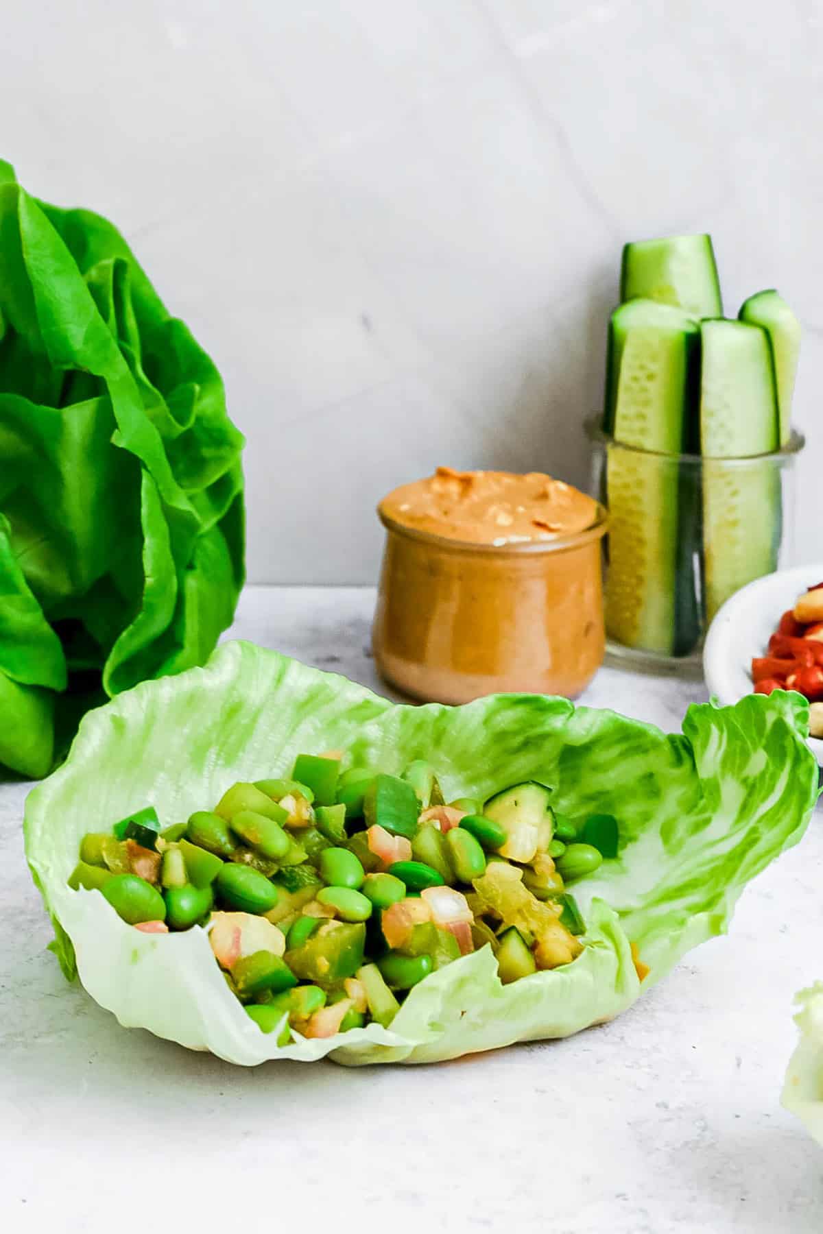 A large edamame peanut lettuce wrap.