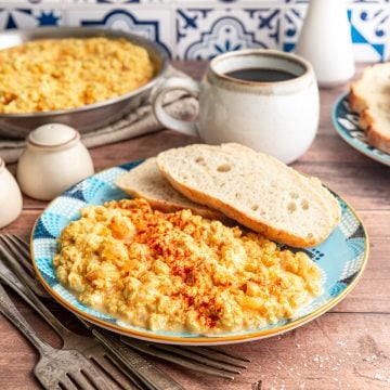 Silken tofu scrambled eggs on a plate, served with toast.