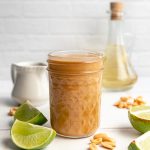 A jar of healthy peanut sesame dressing.