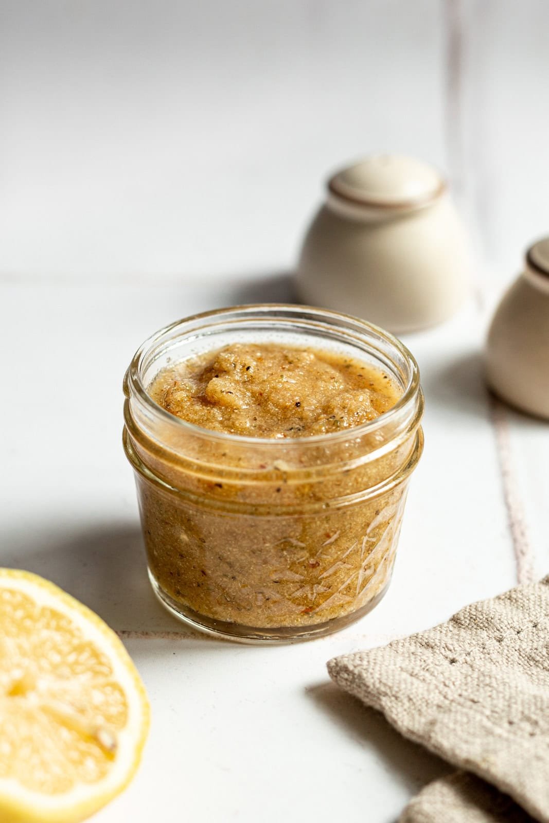 A mason jar of homemade Italian dressing.