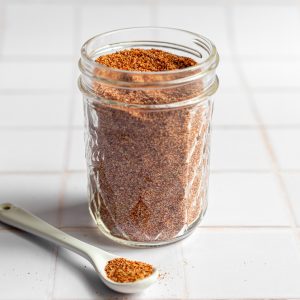 A mason jar filled with homemade taco seasoning.